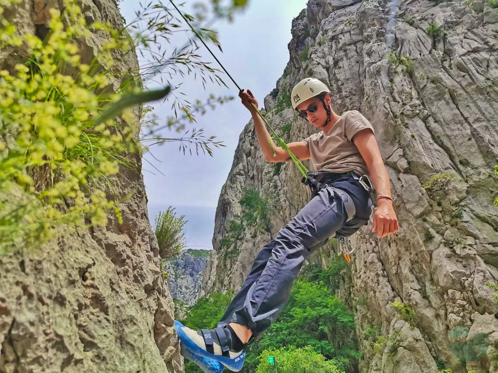 Rock climber hanging on the rope in Paklenica National Park, Starigrad Paklenica, Croatia
