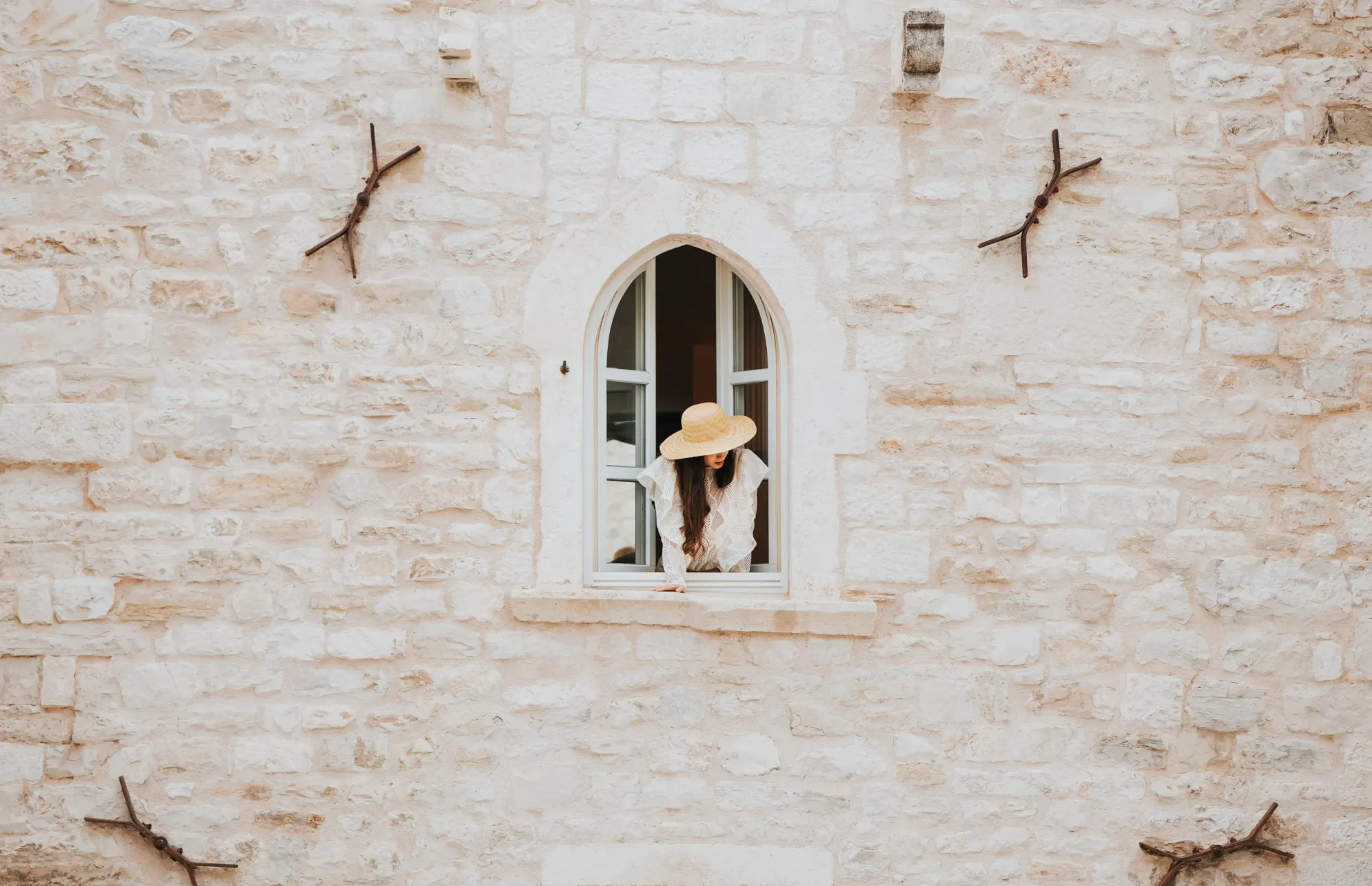 Vestibul Palace Hotel in Split Croatia, the view at the walls and a lady staring out of the window